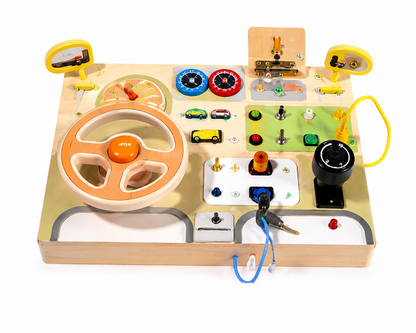 Children's toy dashboard with steering wheel, buttons, and other controls on a white background